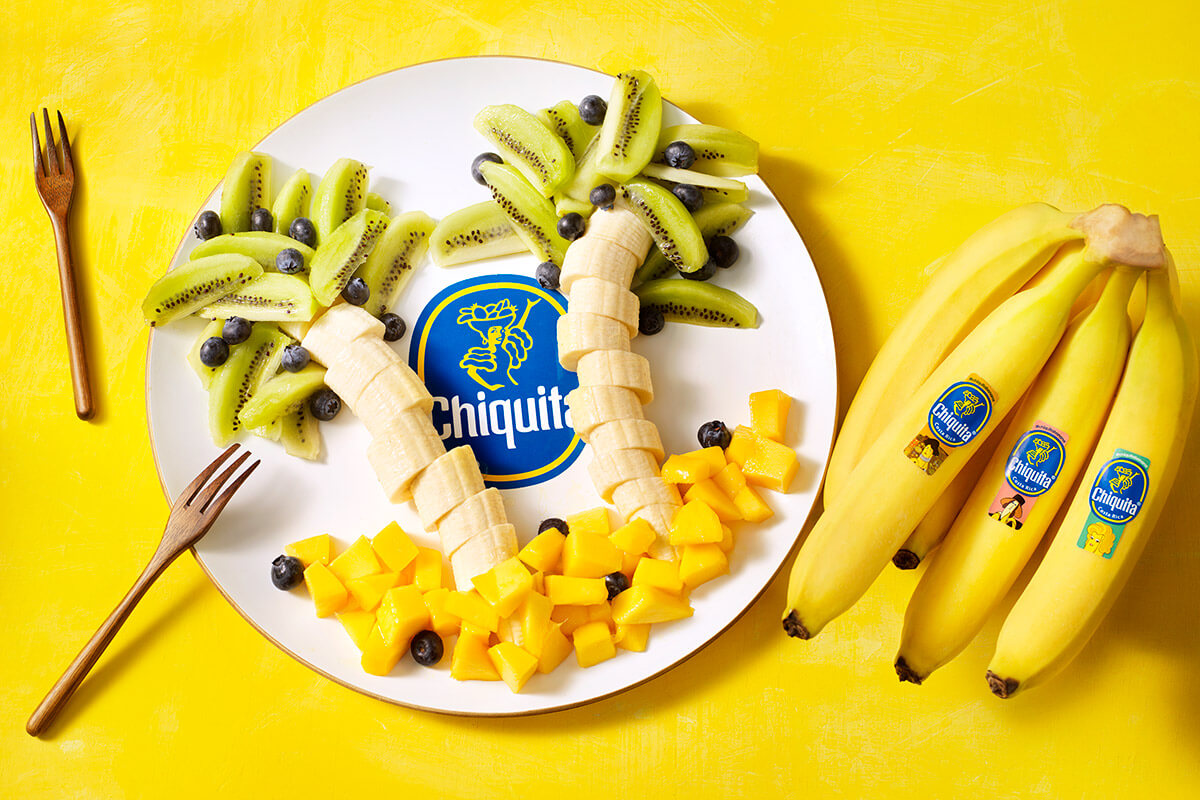 Palmboom van Chiquita banaan, kiwi en mango